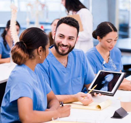 radiologic technologists working with each other in a lab
