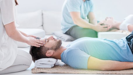 man laying down, receiving a massage