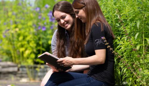 Two people reading together