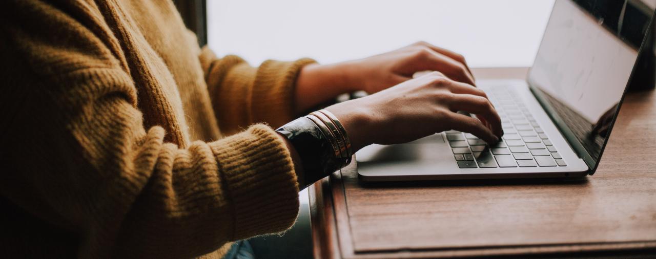 A person typing on a computer