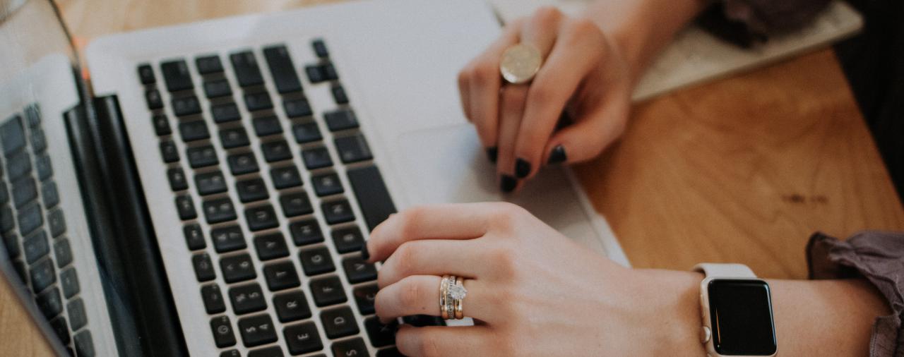 A person typing on a keyboard