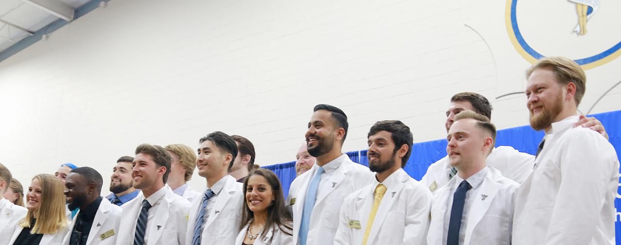Students standing during commencement