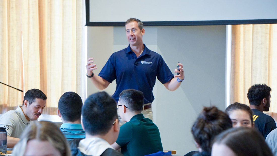 Dr. Kollmann speaking enthusiastically