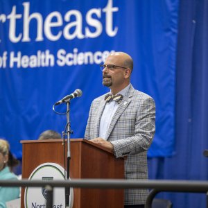 Dr. Mestan speaking at Transitions Cermony