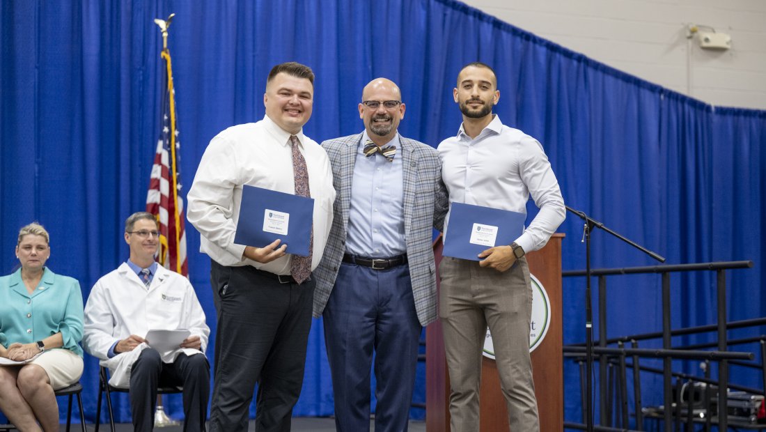 Dr. Mestan with two student award winners