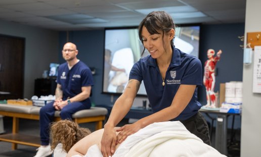Massage therapist student giving a massage