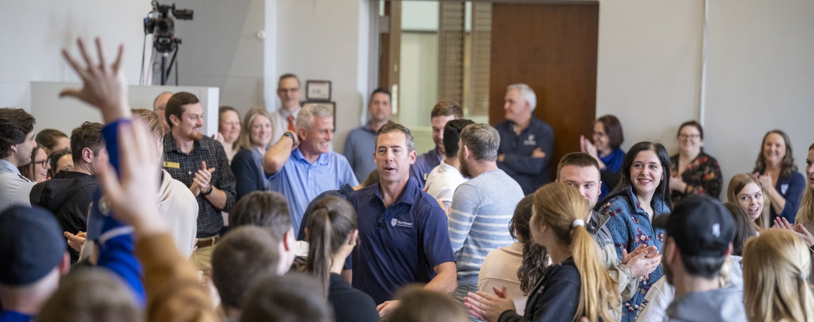 a crowd gathered to hear a speaker
