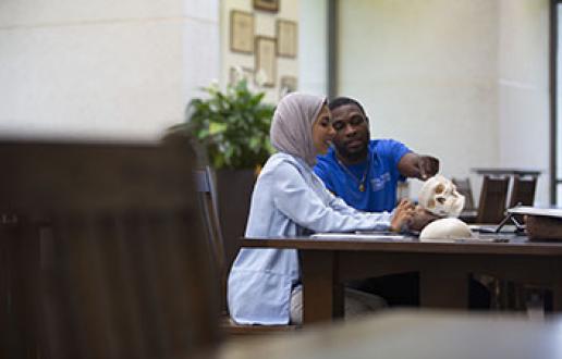 Two students sitting at a table
