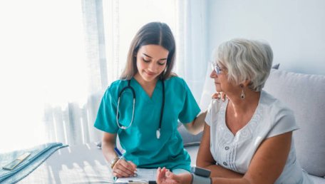 physician assistant sitting with a patient
