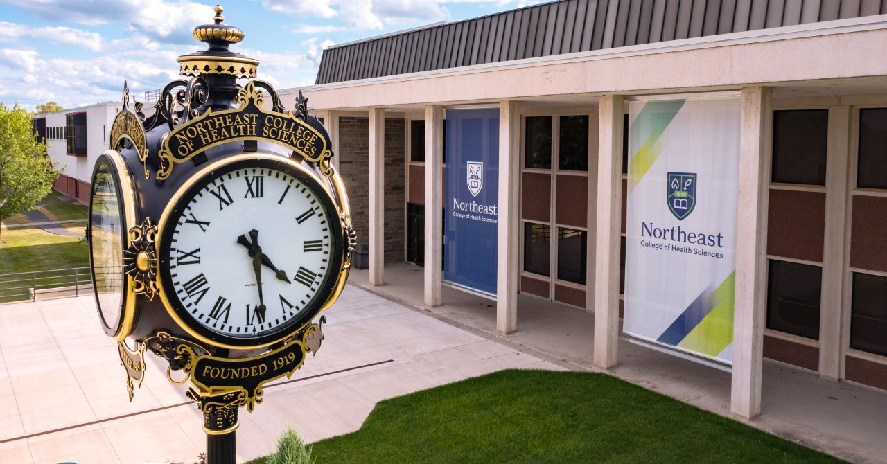 the campus clock plaza, with academic building visible behind