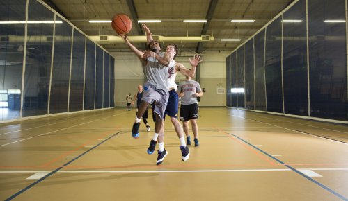 students playing basketball