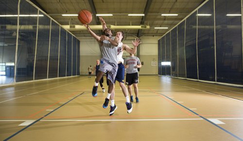 students playing basketball