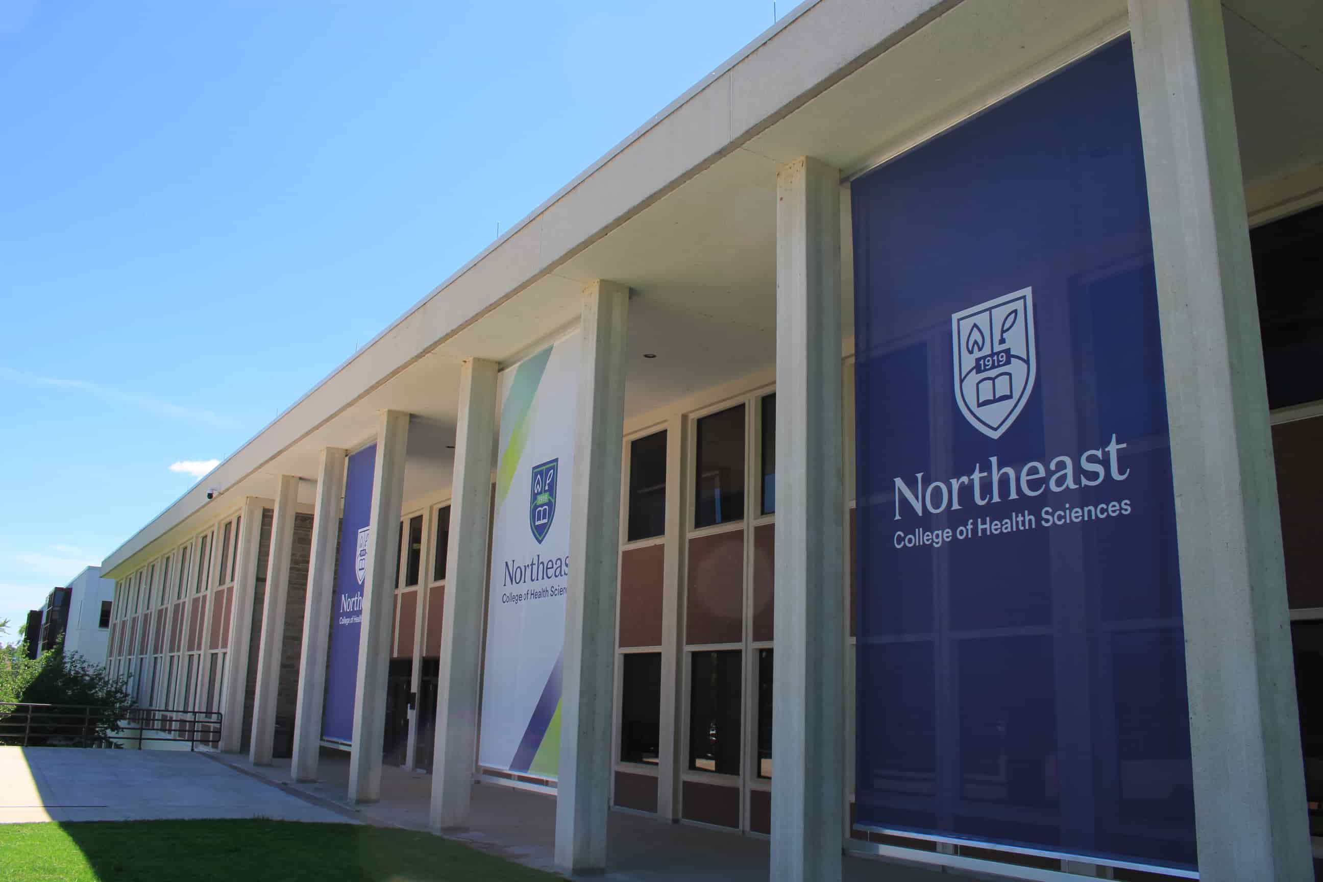 Northeast College campus and clock plaza with banners featuring College logo.
