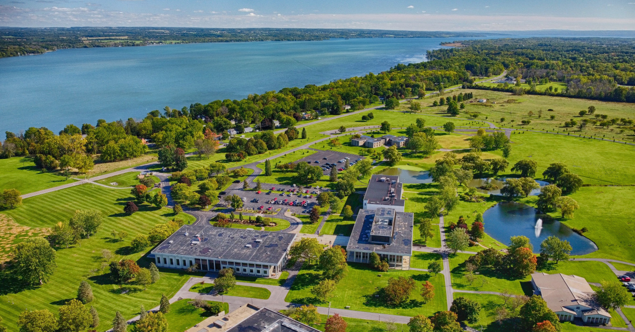 aerial view of campus with Cayuga lake in the background